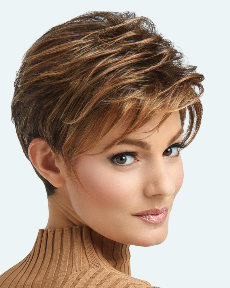 A stunning "Advance French" wig by Raquel Welch, featuring long layers throughout the top and crown. The wig showcases loose, textured lengths creating a windswept, free-formed look. The style is complimented by a smooth, neck-hugging nape, providing a chic and sophisticated appearance. The wig's color and texture convey a sense of modern elegance, making it a versatile choice for various occasions.